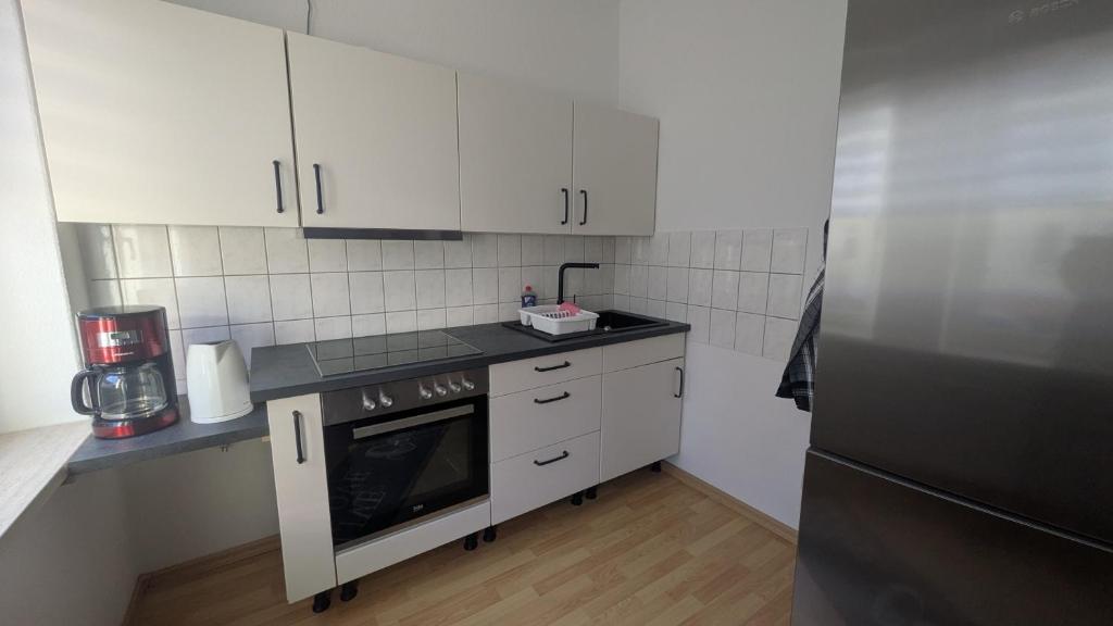 Nhà bếp/bếp nhỏ tại Schickes Apartment mit Stil - 58qm groß