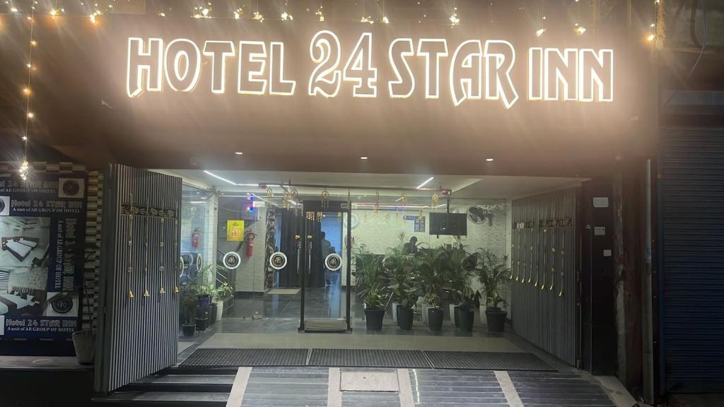 a hotel star inn with a sign above the door at Hotel 24 STAR INN in Jāmb