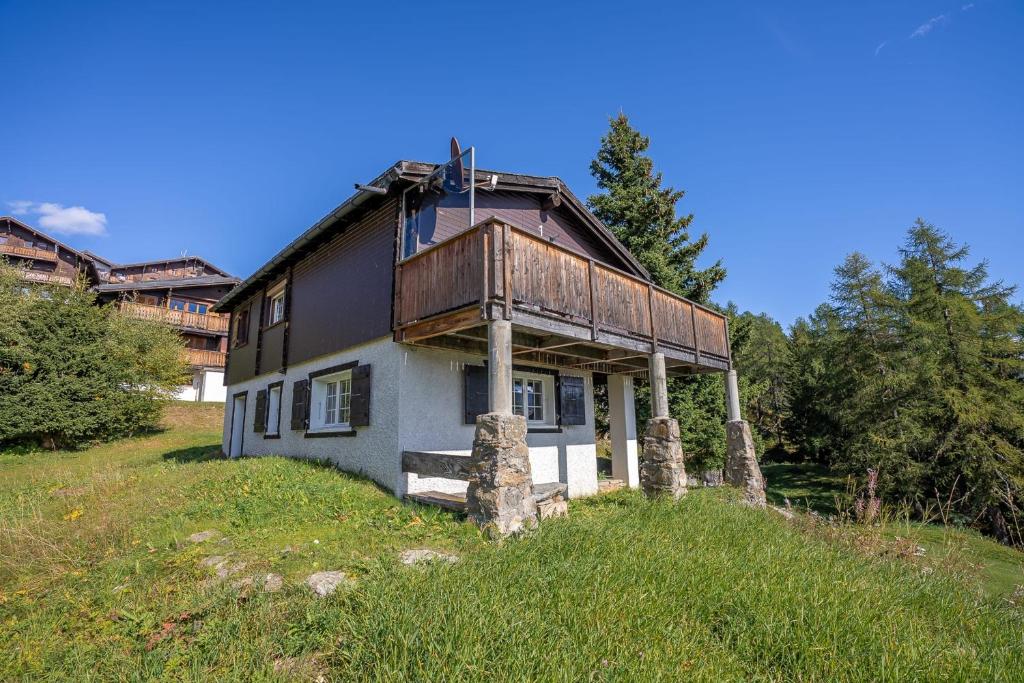 a house sitting on top of a hill at Chalet Mazze in Bettmeralp