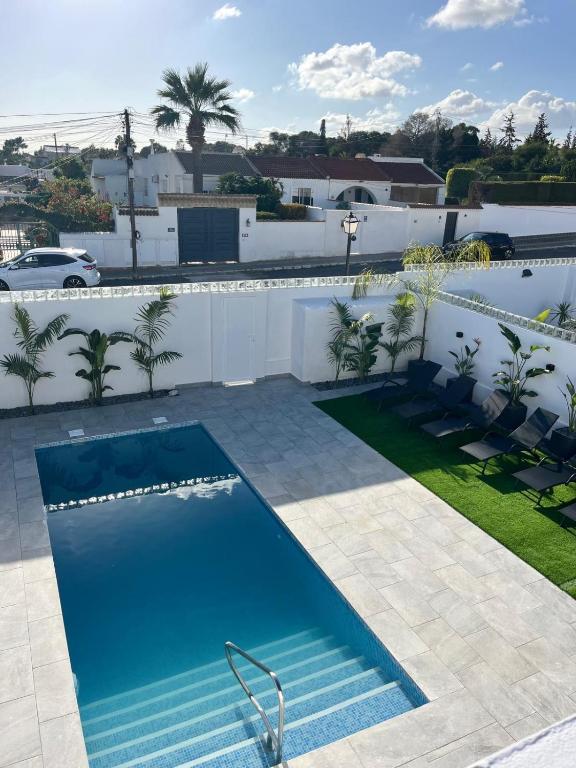 a swimming pool on top of a house at Villa Palma Cabo Roig 31a in Orihuela Costa