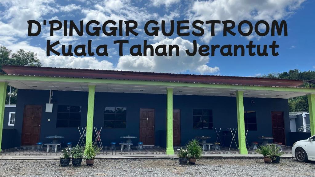 a blue building with a sign that reads dinosaur classroom kula tahitan permit at D'pinggir Guest Room in Kuala Tahan