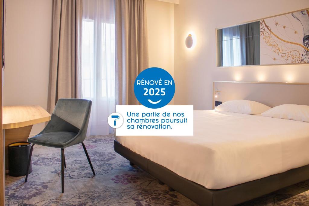 Giường trong phòng chung tại Brit Hotel Cahors - Le Valentré