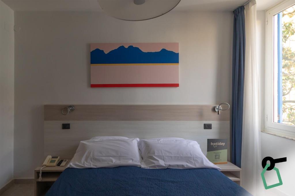 Postel nebo postele na pokoji v ubytování Hotiday La Spezia Centrale