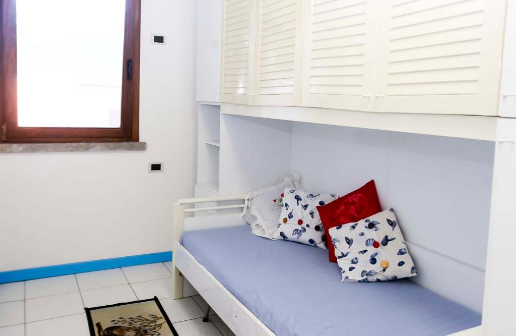 A bed or beds in a room at Il Porto trilocale nr.7