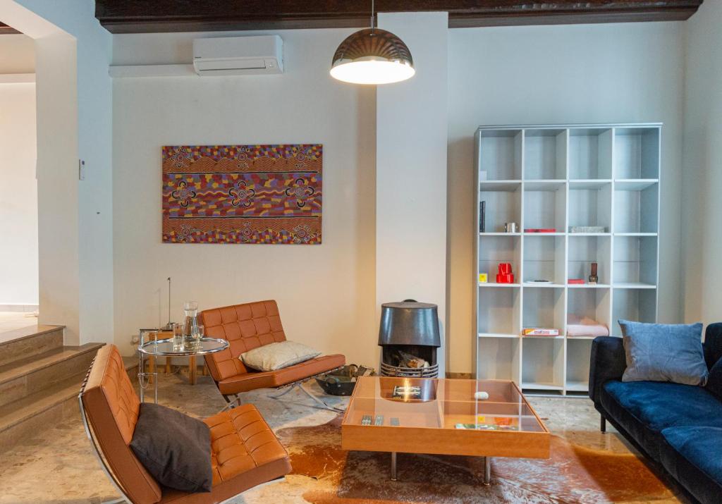a living room with a couch and a table at De Wijngaard in Ghent