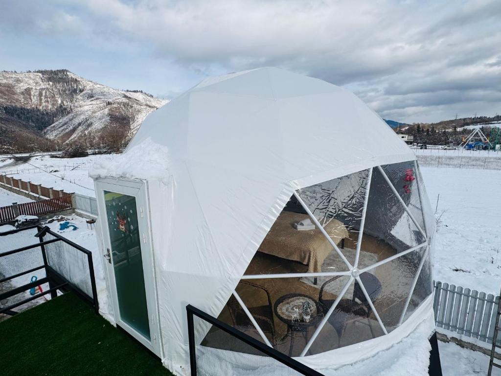 a dome tent with snow on top of it at Buddy glamping Borjomi in Borjomi