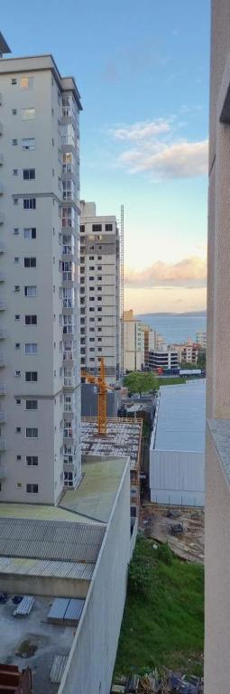 a view of a city skyline with tall buildings at Apartamento perto da Praia em Itapema!!! in Itapema