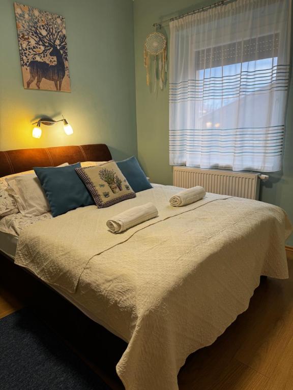 Postel nebo postele na pokoji v ubytování Levendula Apartmanház