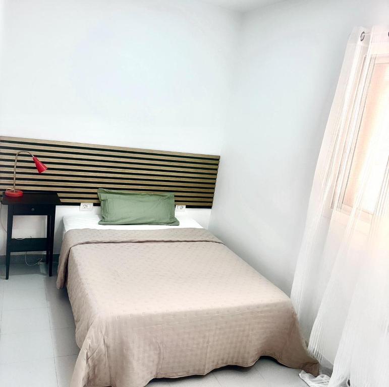 En eller flere senge i et værelse på Casa Capitan Coliving Digital Nomads