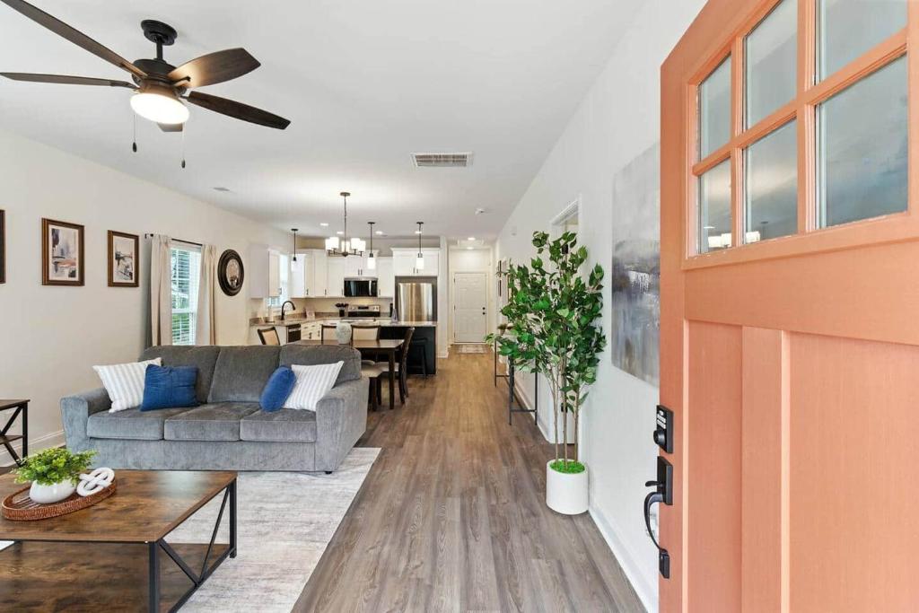 a living room with a couch and a table at Heart of Cedartown | 0.3 miles from the Silver Comet Trail in Cedartown