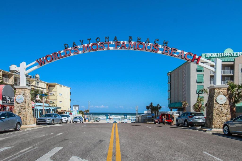 a street with a sign that reads worlds most famous beach at Daytona Beach in Daytona Beach
