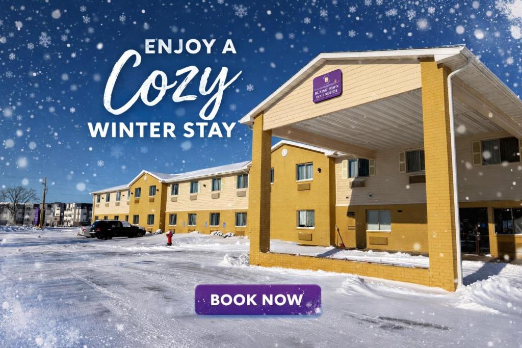 a sign that reads enjoy a cozy winter stay at a hotel at Blaine Town Inn & Suites in Blaine