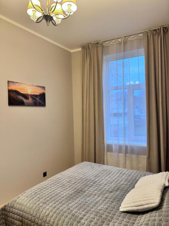 En eller flere senge i et værelse på Saulgrieži