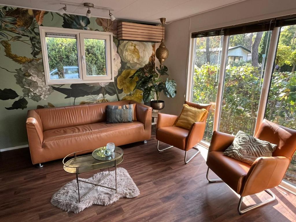 a living room with a couch and two chairs at Chalet Bosrand 42 Park Veluwshof 6 p in Hoenderloo