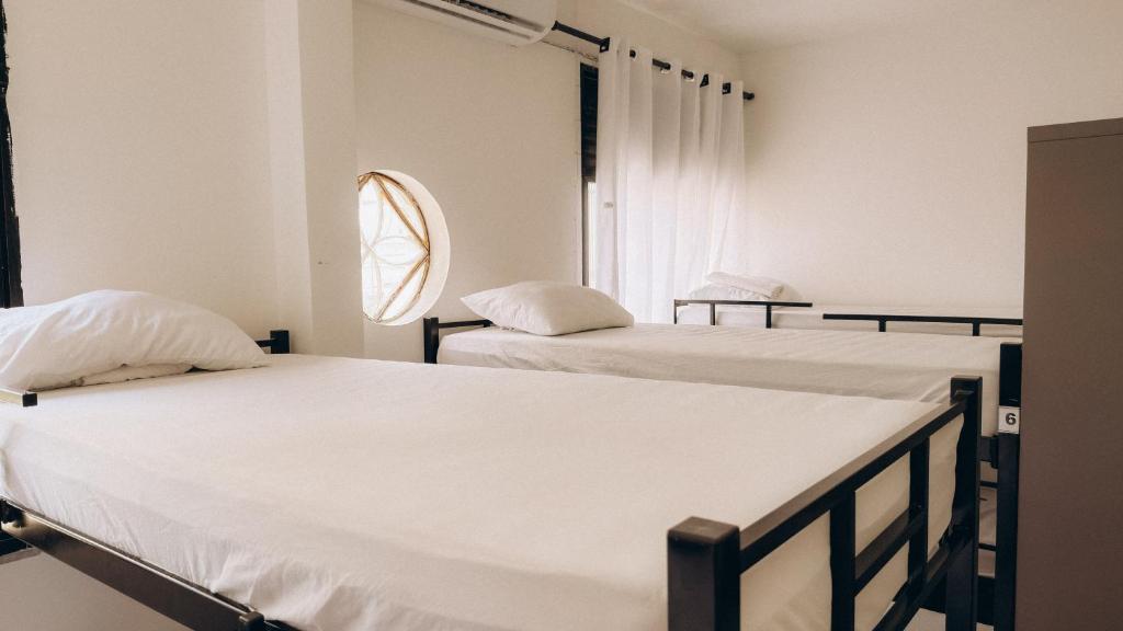 Postel nebo postele na pokoji v ubytování Hostel Barra 163