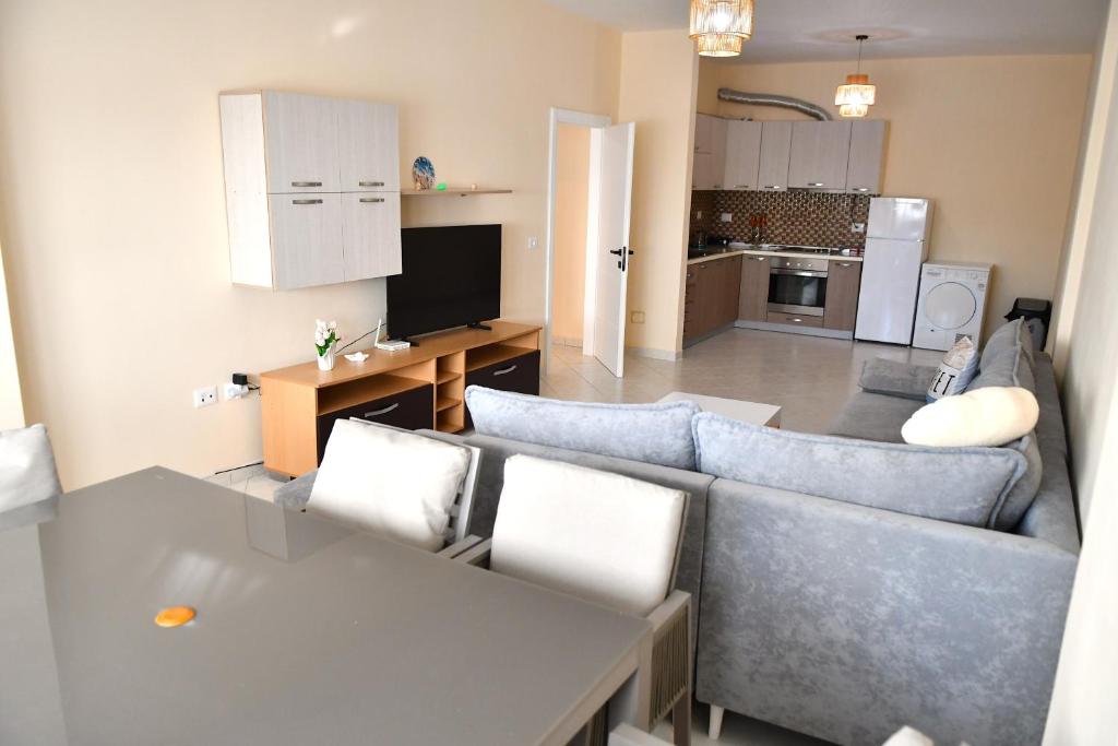 a living room with a couch and a table at Coastal Calm in Golem