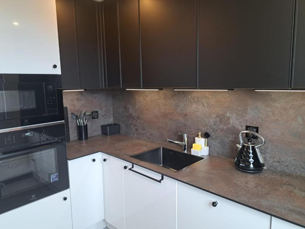 Køkken eller tekøkken på Apartament Patka Wysoki STANDARD