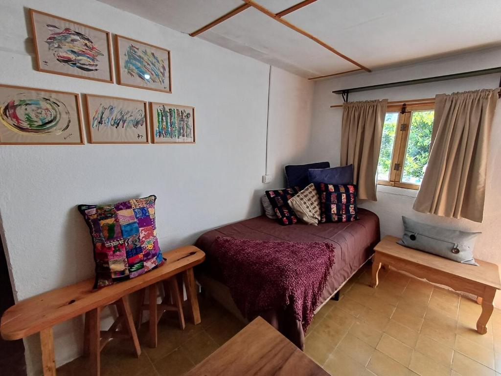 Postel nebo postele na pokoji v ubytování Peaceful Hidden Cabin in Panajachel