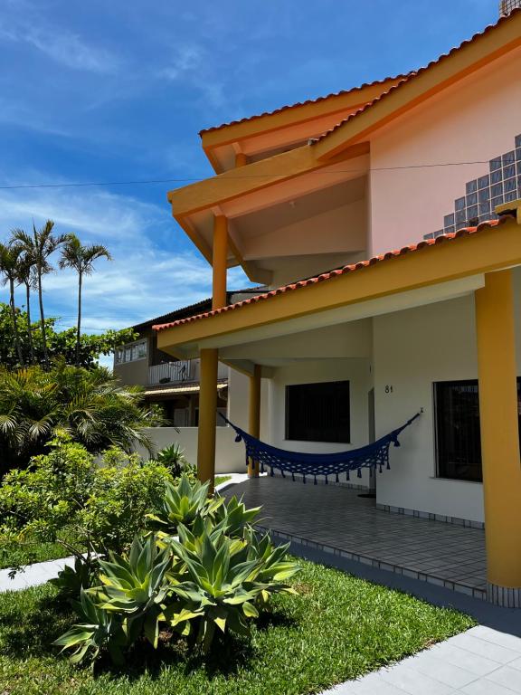a view of a house with a porch at A casa do sonho in Palhoça