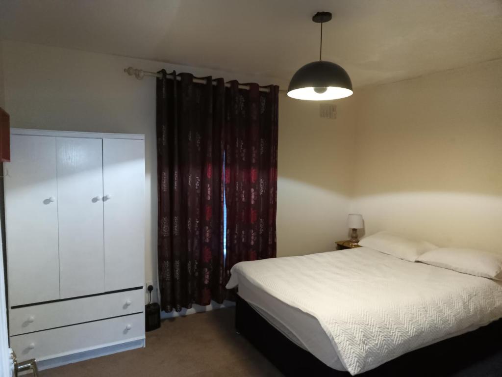 En eller flere senge i et værelse på Bayview