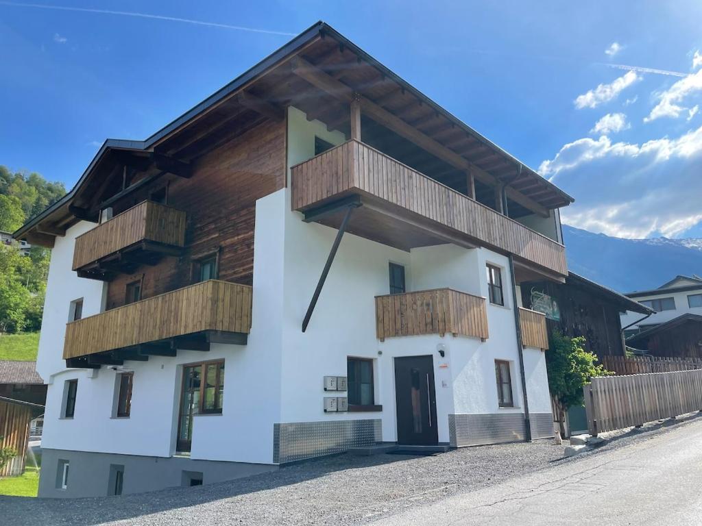 a house with wooden balconies on the side of it at Haus Antonia in Kauns