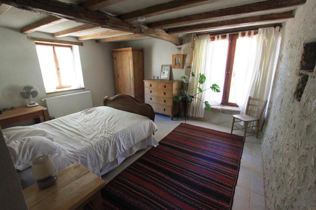 Postel nebo postele na pokoji v ubytování Au garcin