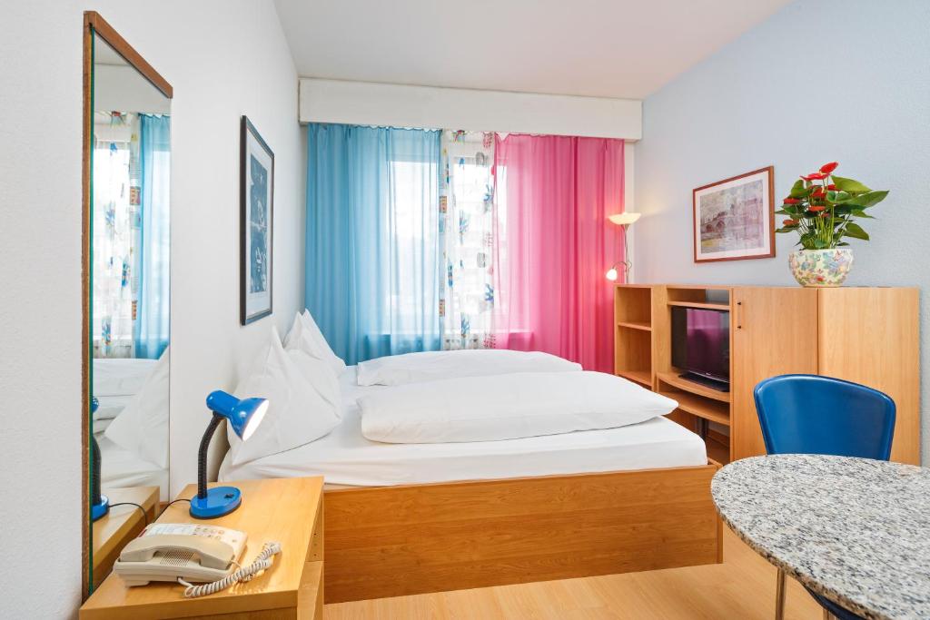 Postel nebo postele na pokoji v ubytování Residence zum Löwen