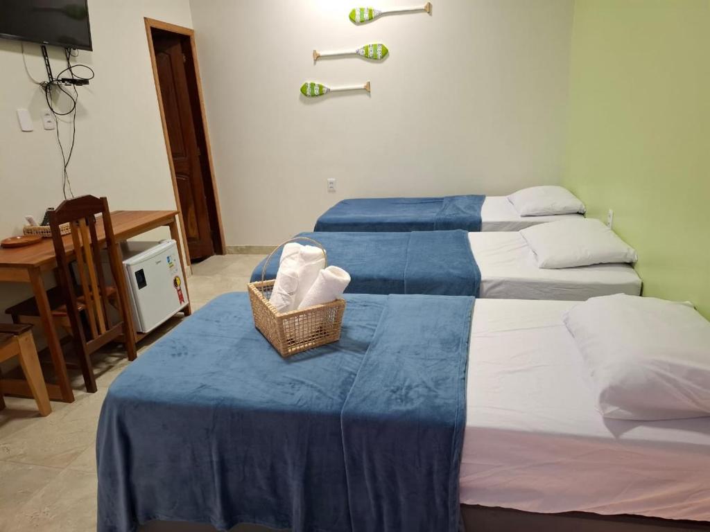 Ein Bett oder Betten in einem Zimmer der Unterkunft Pousada Banzeiro Marajó