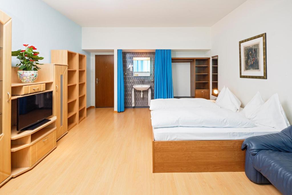 Postel nebo postele na pokoji v ubytování Residence zum Löwen