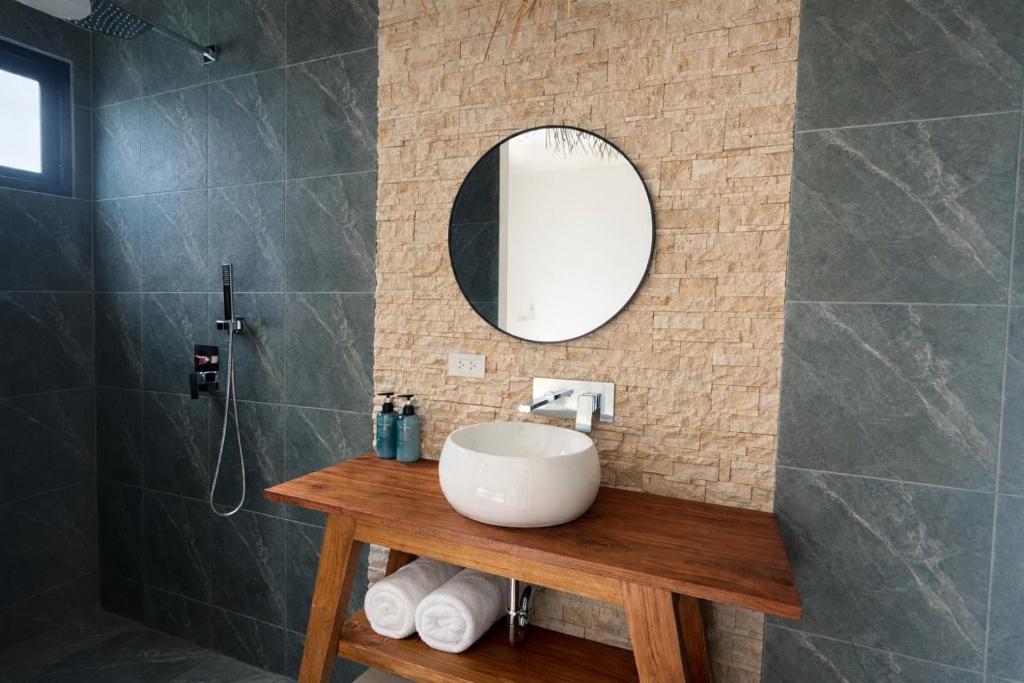 a bathroom with a sink and a mirror at Sea View Koh Phangan in Ban Tai