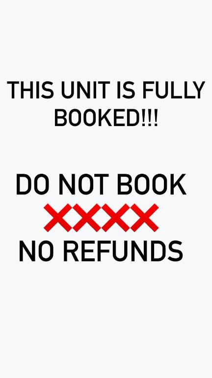 a sign that says this unit is fullybookeddo not book no refunds at nout availabilt fuloyyy booked nouuu reifounds in Tuguegarao City