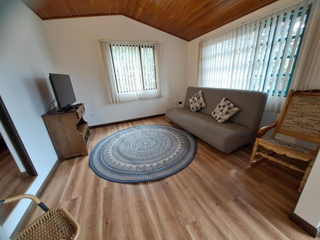 a living room with a couch and a table at El Embeleso in Nobsa