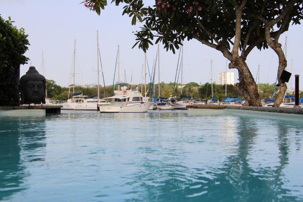 a body of water with boats in a marina at Villa lagon bleu in Le Gosier