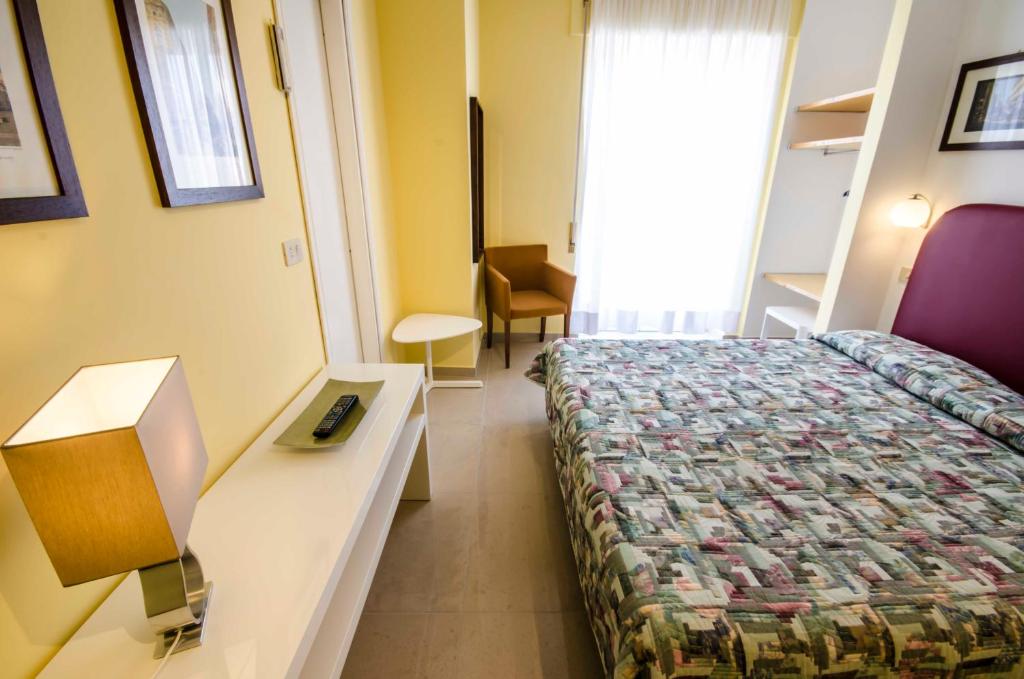 Postel nebo postele na pokoji v ubytování Hotel Tarconte