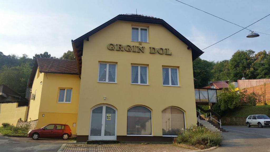 a yellow building with the words chalk box on it at Guest House Grgin Dol in Požega