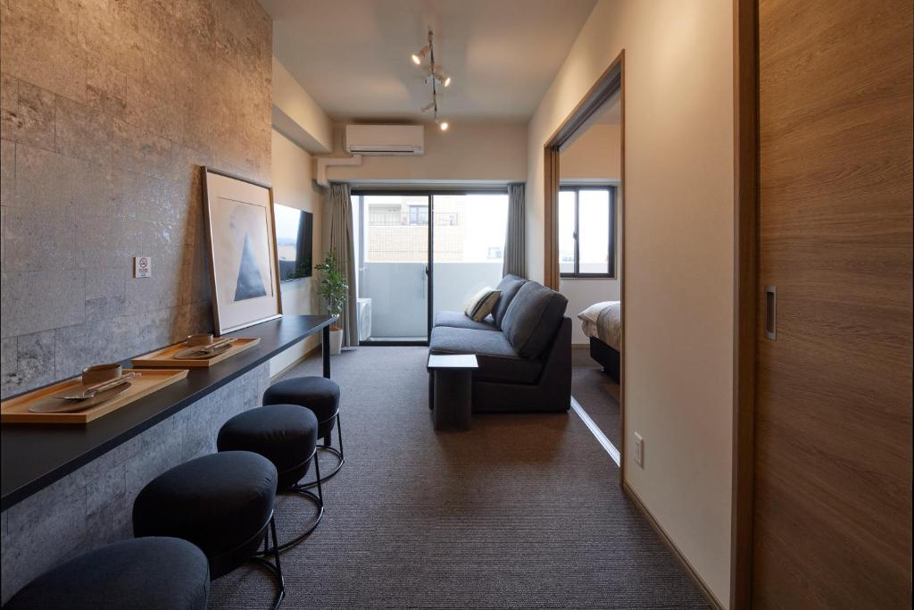 TV a/nebo společenská místnost v ubytování Living like Hotel 博多駅前