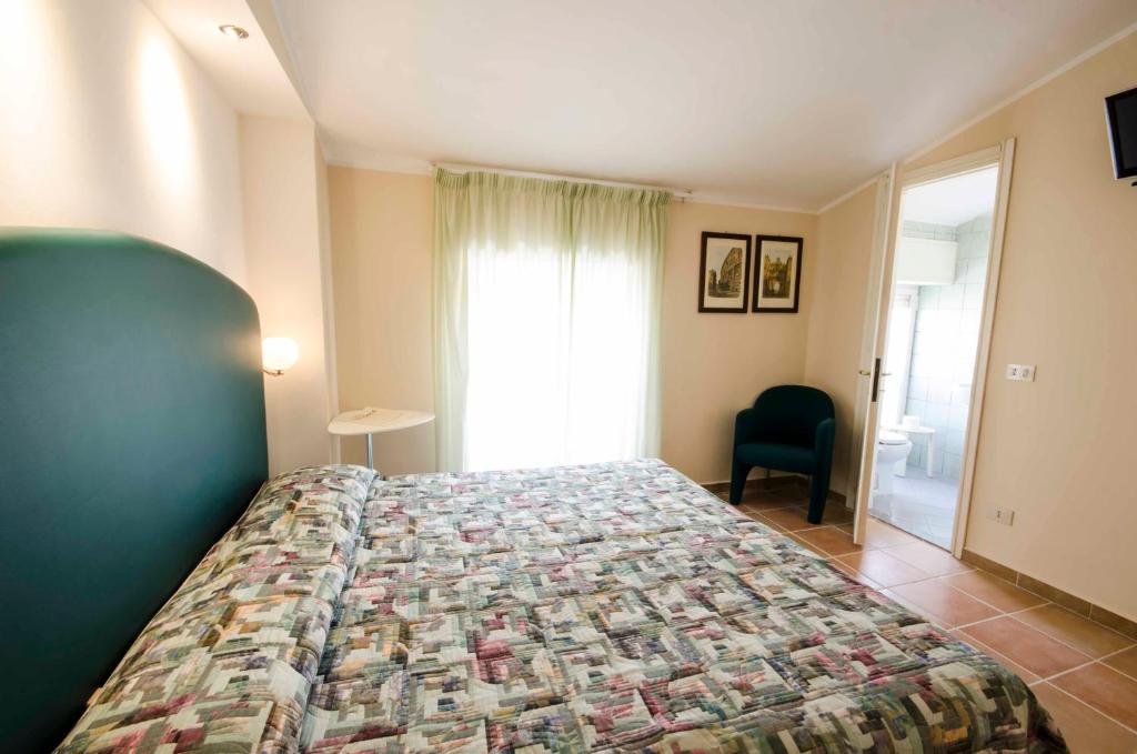 Postel nebo postele na pokoji v ubytování Hotel Tarconte