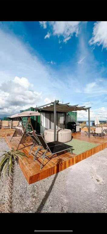 a building on a beach with aitating at Atacama container in Brasília