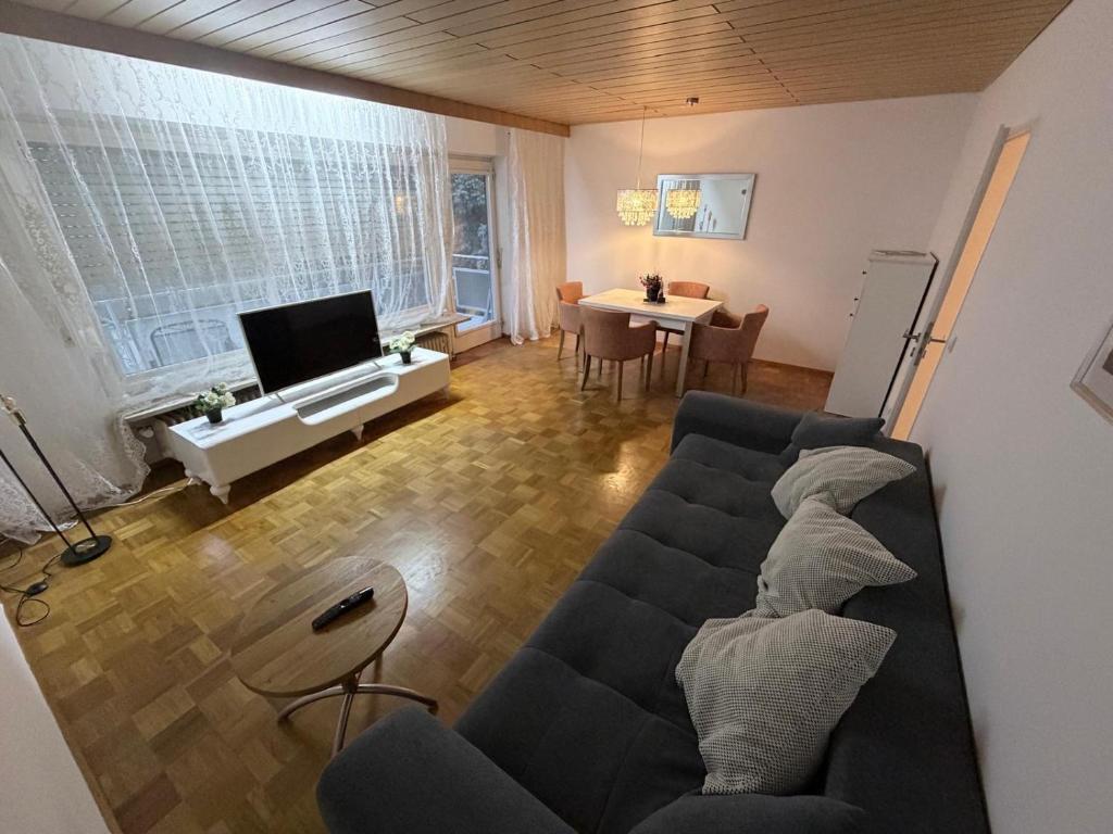 a living room with a couch and a table at FerienwohnungNord in Singen