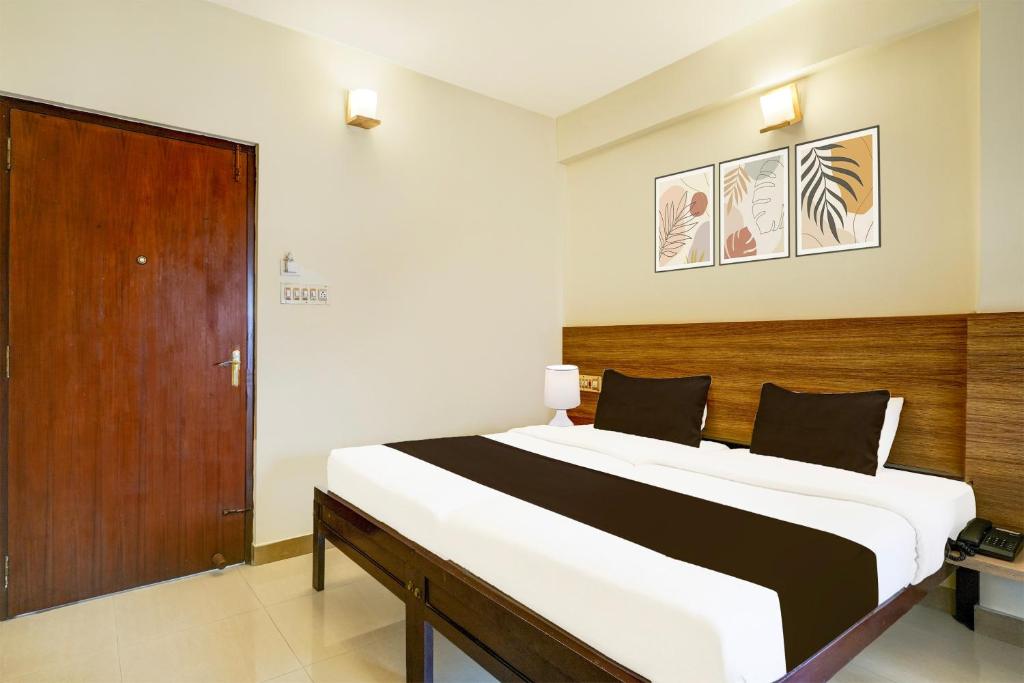 En eller flere senge i et værelse på Super Collection O MG Road