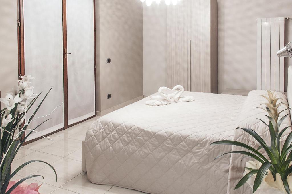 A bed or beds in a room at La Tarantola