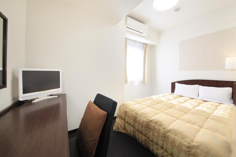 TV a/nebo společenská místnost v ubytování Fuchu Urban Hotel Annex