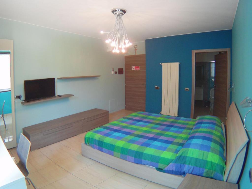 A bed or beds in a room at La Tarantola