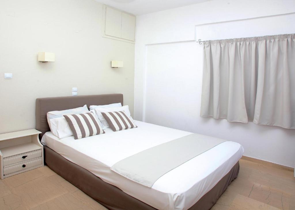 Postel nebo postele na pokoji v ubytování Iraklis Apartments