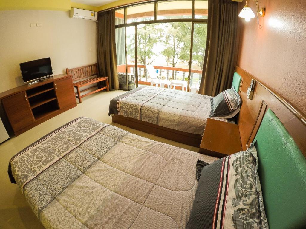 Кровать или кровати в номере Madam House