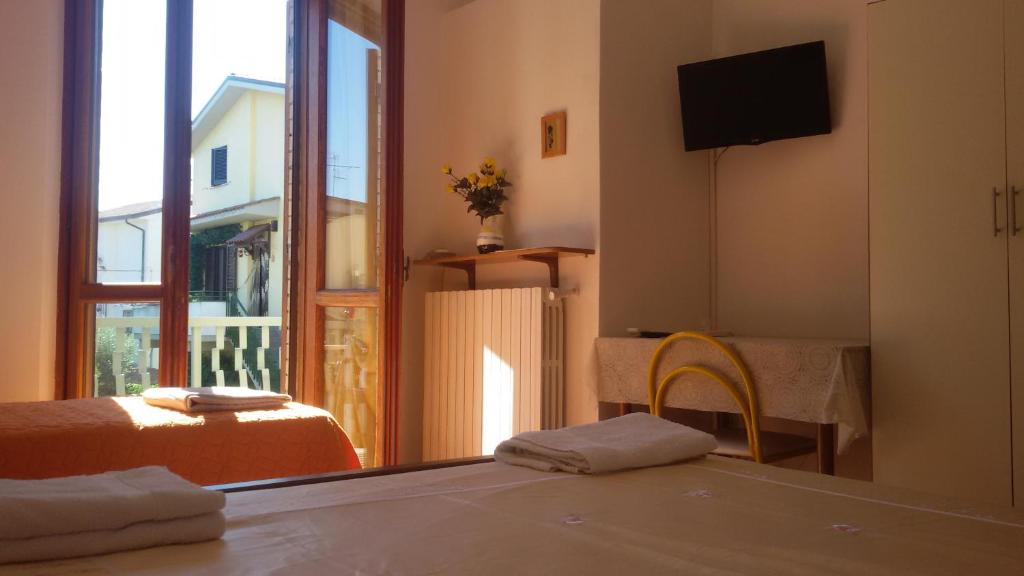 En eller flere senge i et værelse på Apartment Via Vittoria