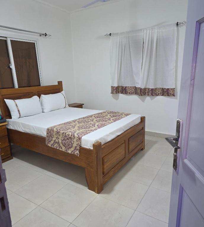 Giường trong phòng chung tại JEK Villa