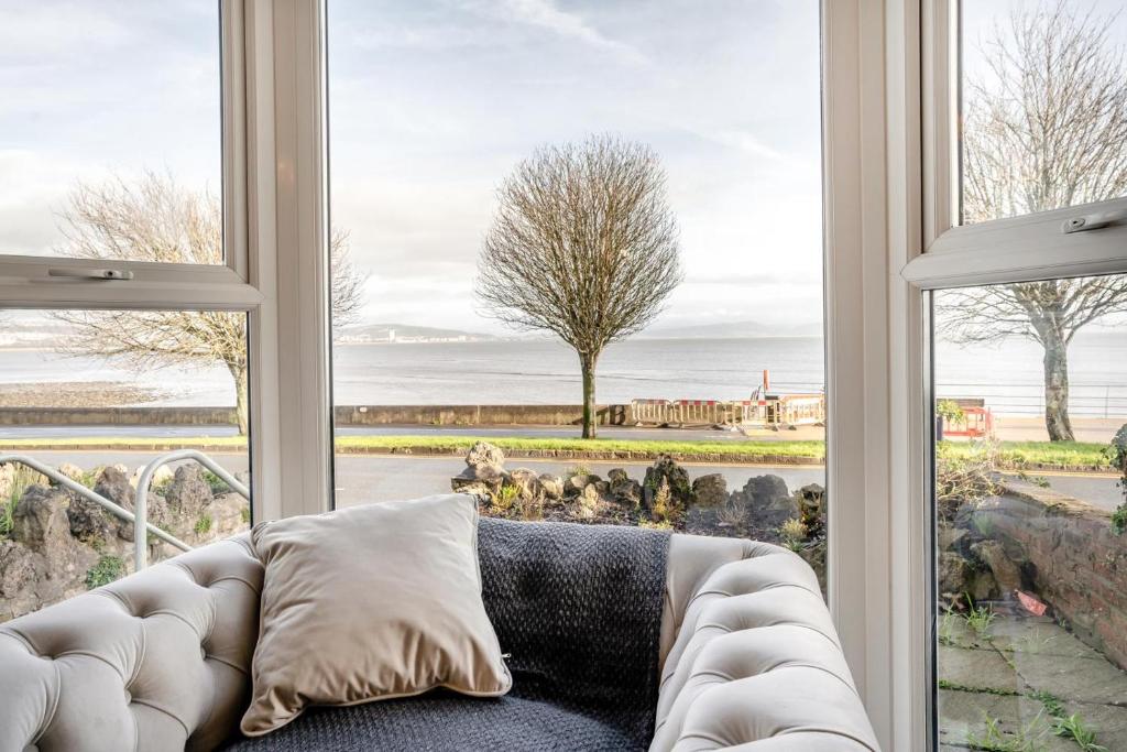 a living room with a couch in front of a window at 5 Bed in Mumbles oc-l34618 in The Mumbles