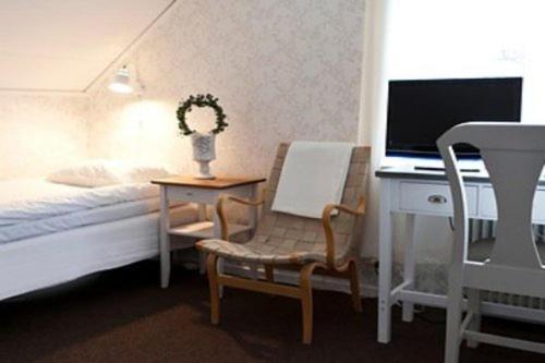 TV a/nebo společenská místnost v ubytování Bjurfors Hotell & Konferens