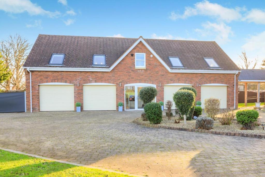 a brick house with four garage doors at 2 Bed in Duddlestone oc-q34588 in Duddlestone